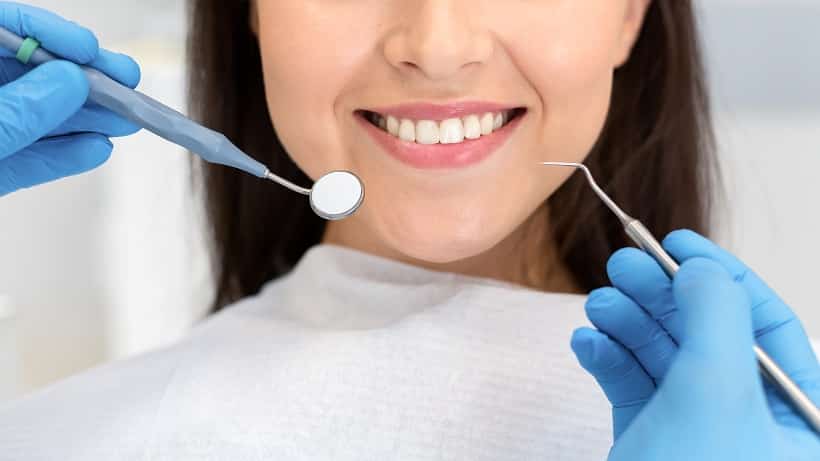 smiling woman attenting dental clinic